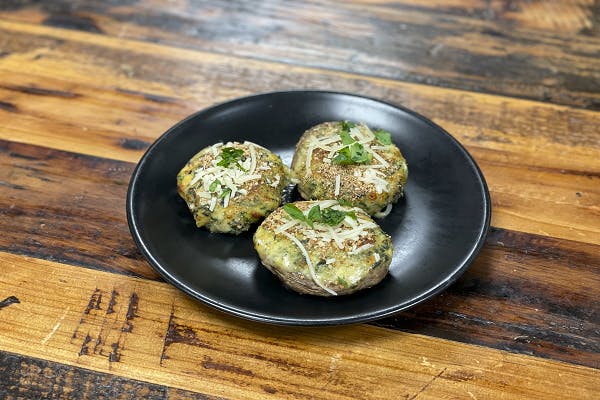 Spinach Stuffed Mushrooms Caps from Sip Wine Bar & Restaurant in Tinley Park, IL