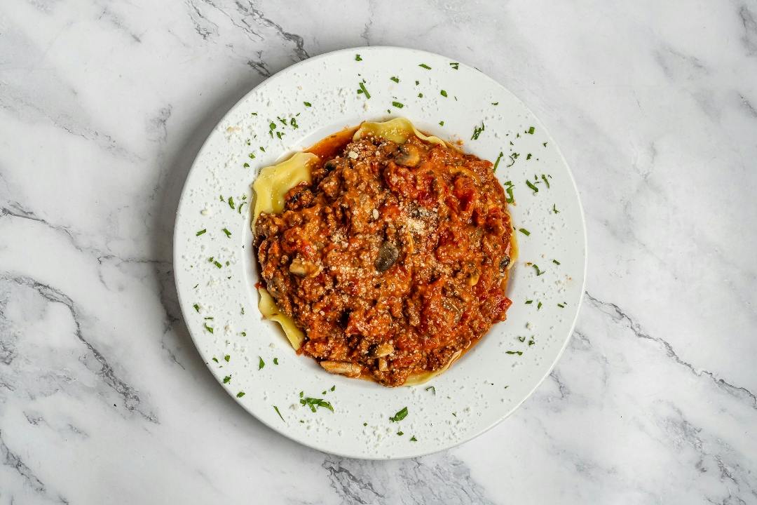 Ravioli Bolognese from 4 Brothers Italian Restaurant & Pizzeria in Delray Beach, FL