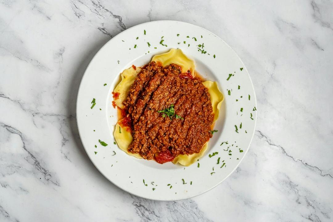 Ravioli Meat Sauce from 4 Brothers Italian Restaurant & Pizzeria in Delray Beach, FL