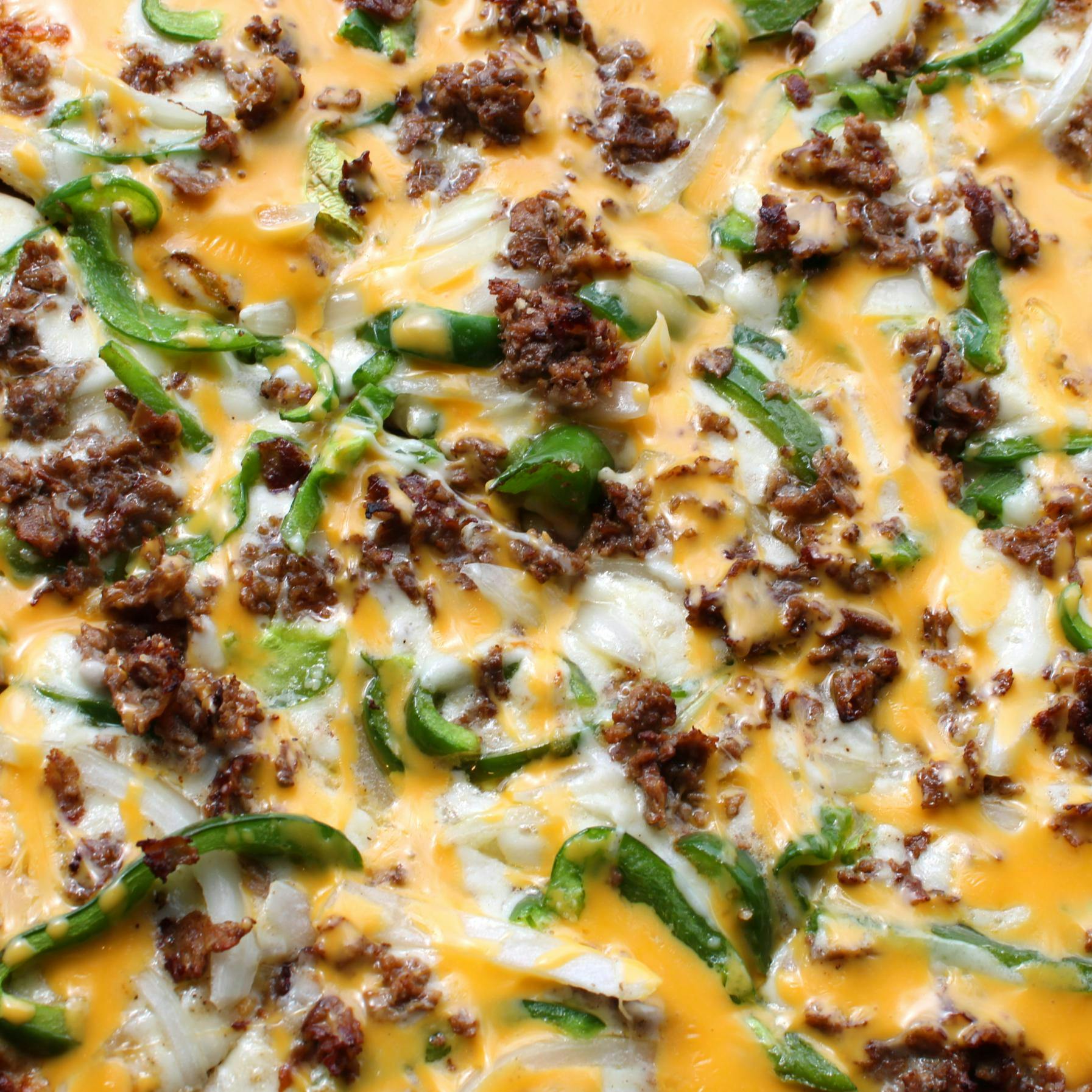 Philly Cheesesteak Pizza from Holidays Pub & Grill in Appleton, WI