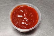 E15. Sriracha Hot Chili Sauce (2 oz.) from Asian Flaming Wok in Madison, WI