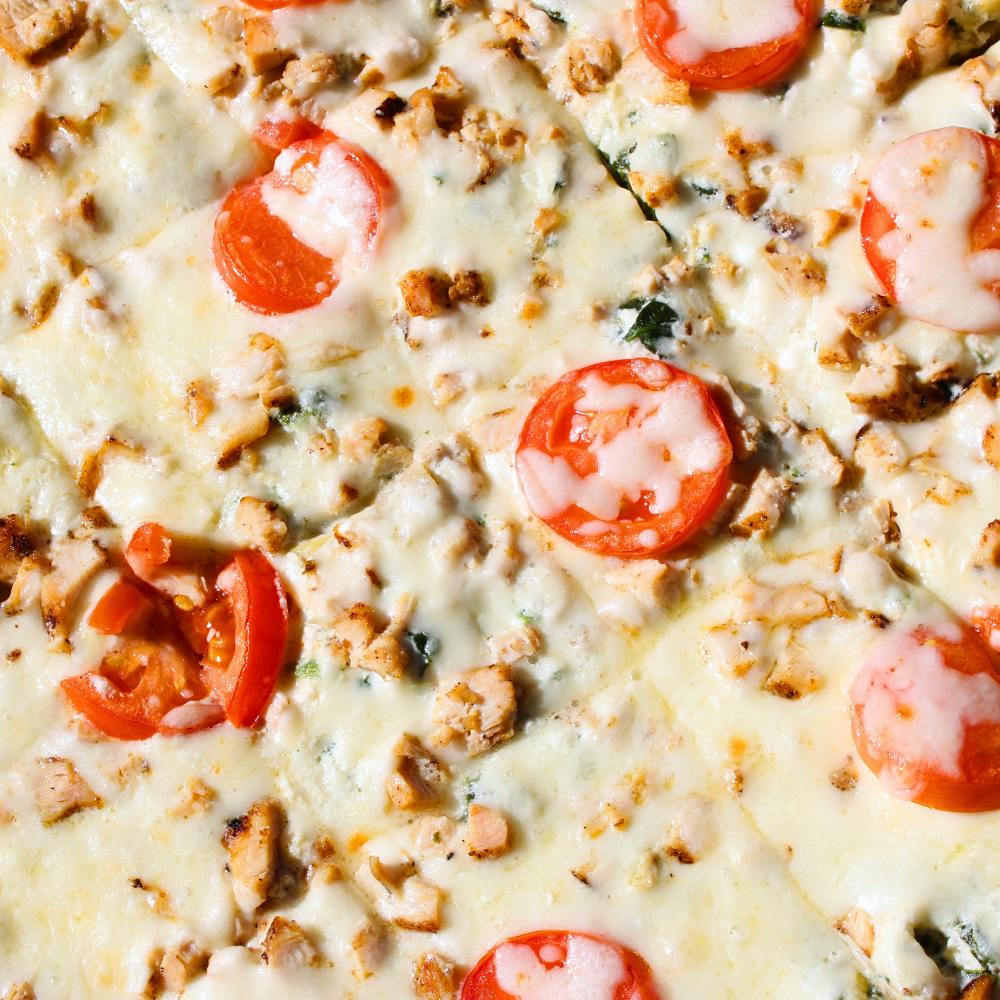 Spinach and Artichoke Chicken Pizza from Holidays Pub & Grill in Appleton, WI