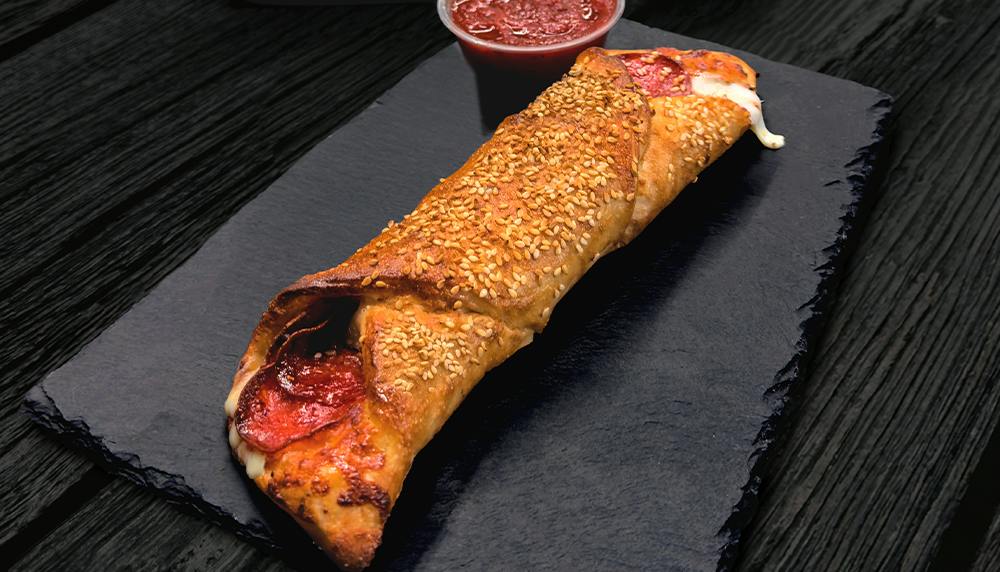 Famous Delicious Beef Pepperoni Roll W/ Marinara Sauce from Happy's Pizza in Whitehall, OH