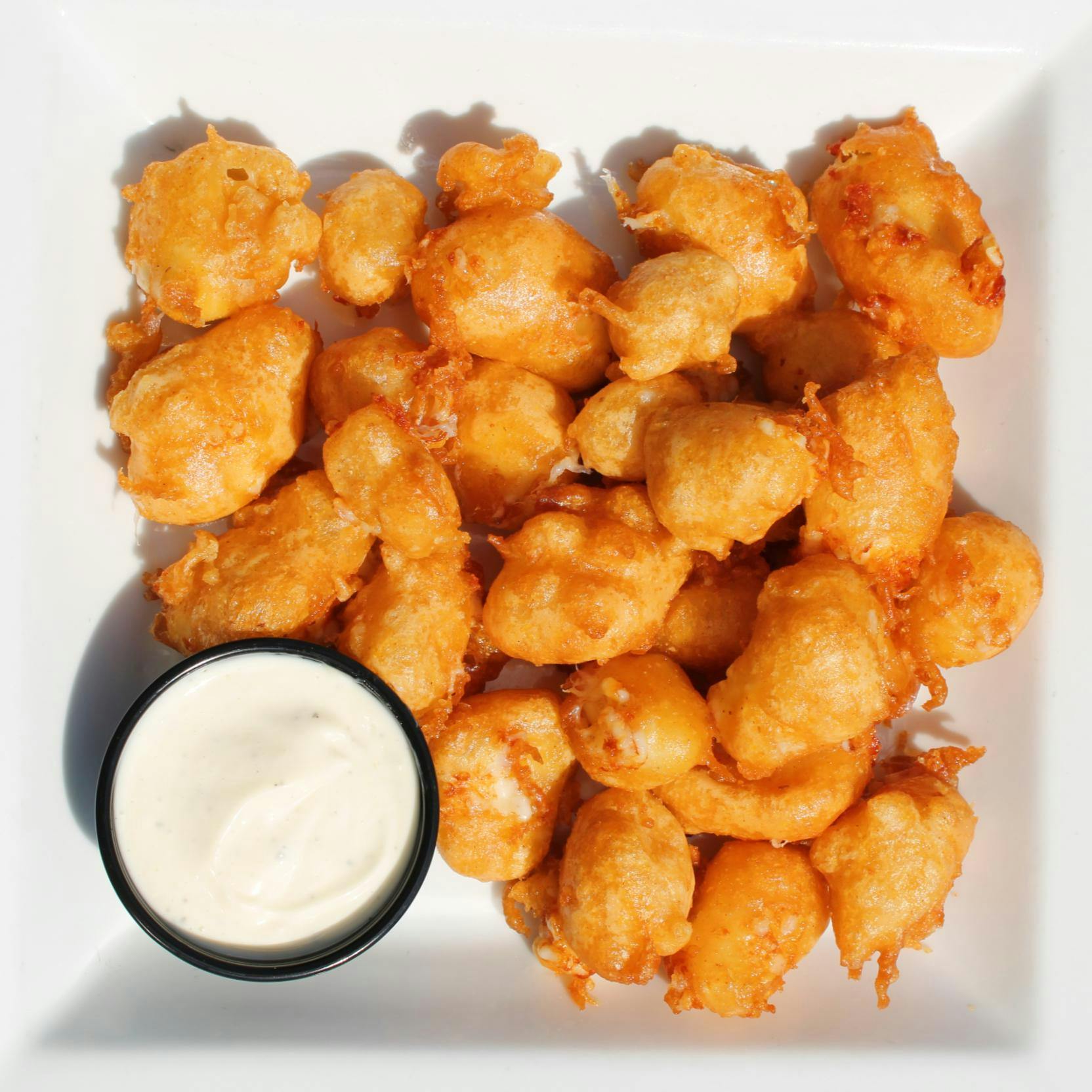 Spotted Cow Battered Cheese Curds from Holidays Pub & Grill in Appleton, WI