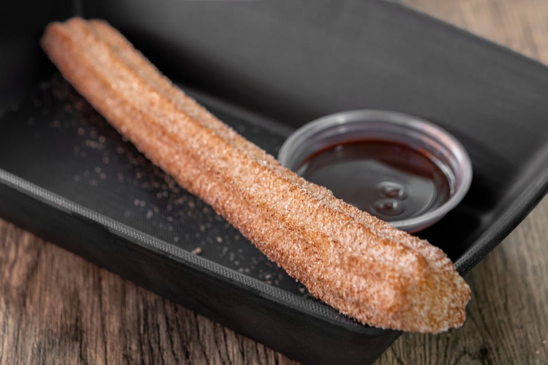 Churro w/ chocolate from Brushfire Tacos y Tapas - Happy Valley in Glendale, AZ