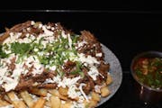 Disco birria fries from Planet Taco - 9th Ave in New York, NY
