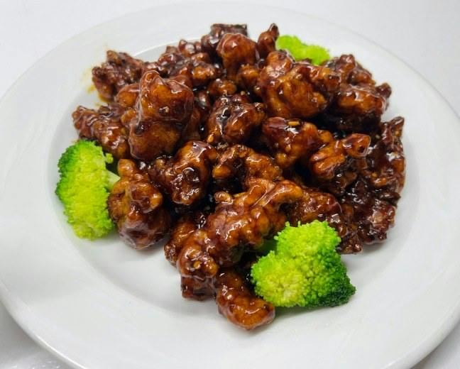 Bourbon Chicken from Happy Wok - Elmwood Ave in Middleton, WI