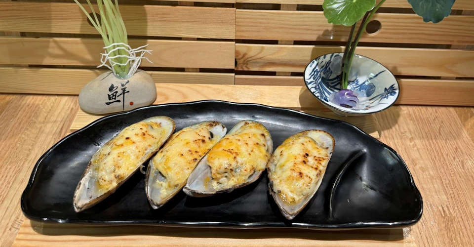 Bake Mussels with Cheese from Dodomi Sushi Rotary - N Sheridan Rd in Chicago, IL