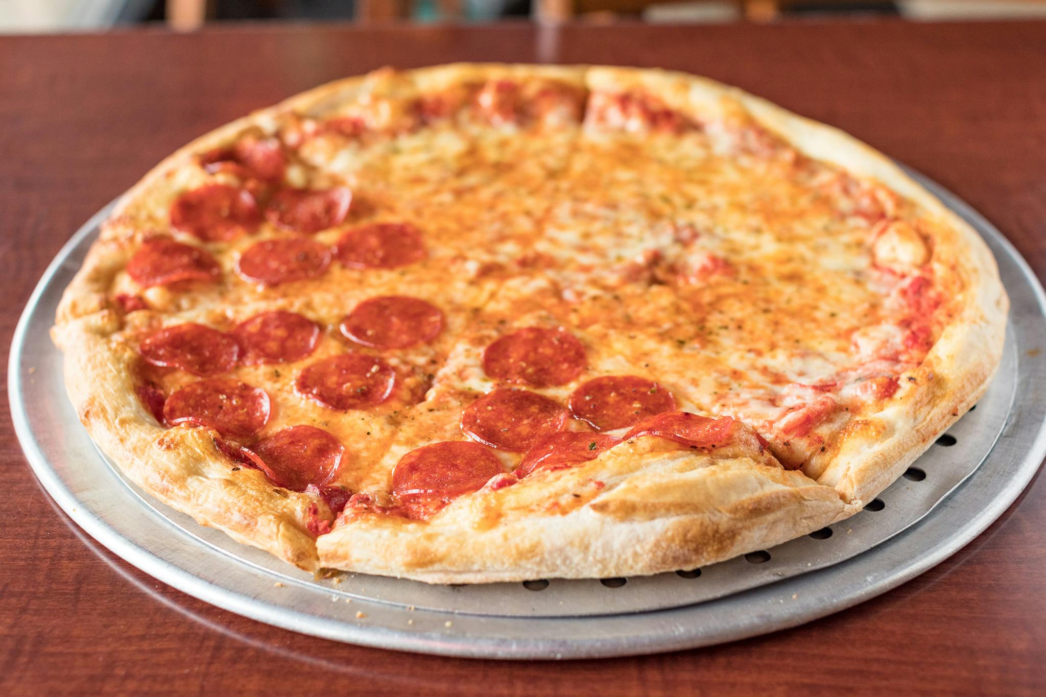 1 Topping 18" Large Pie from Johnny's Pizza Shop in Eau Claire, WI