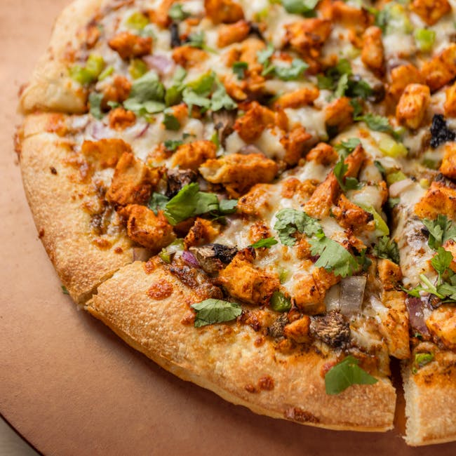 Halal Masala Chicken Pizza from Z?s Pizza - NE 8th St in Bellevue, WA