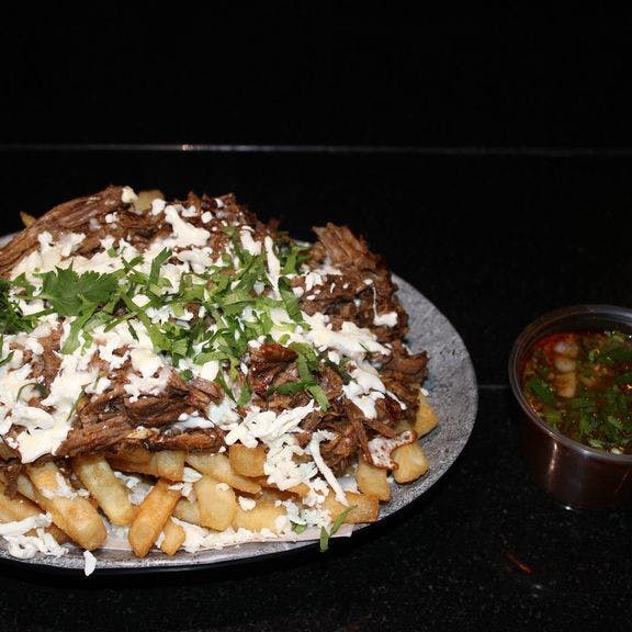 Disco birria fries from Planet Taco - 9th Ave in New York, NY