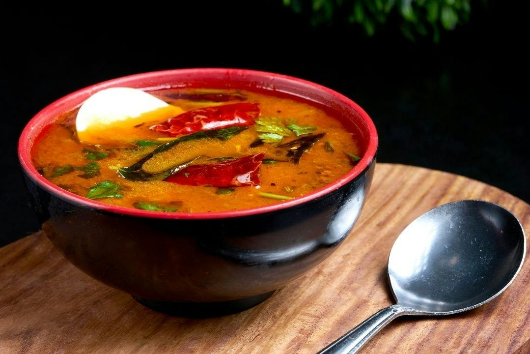 Natukodi Rasam (Country Chicken Soup) from Rock N Grill Indian Authentic Cuisine & Bar in Round Rock, TX