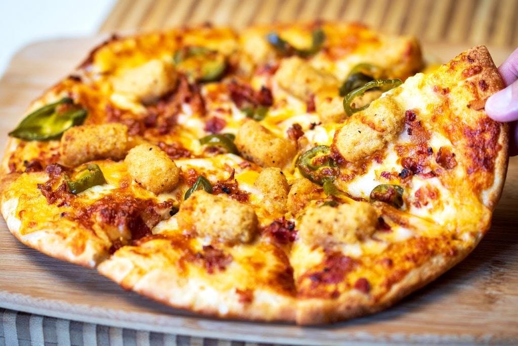 The Cheesecurd-Tastrophe Pizza from The Growler Guys in Eau Claire, WI
