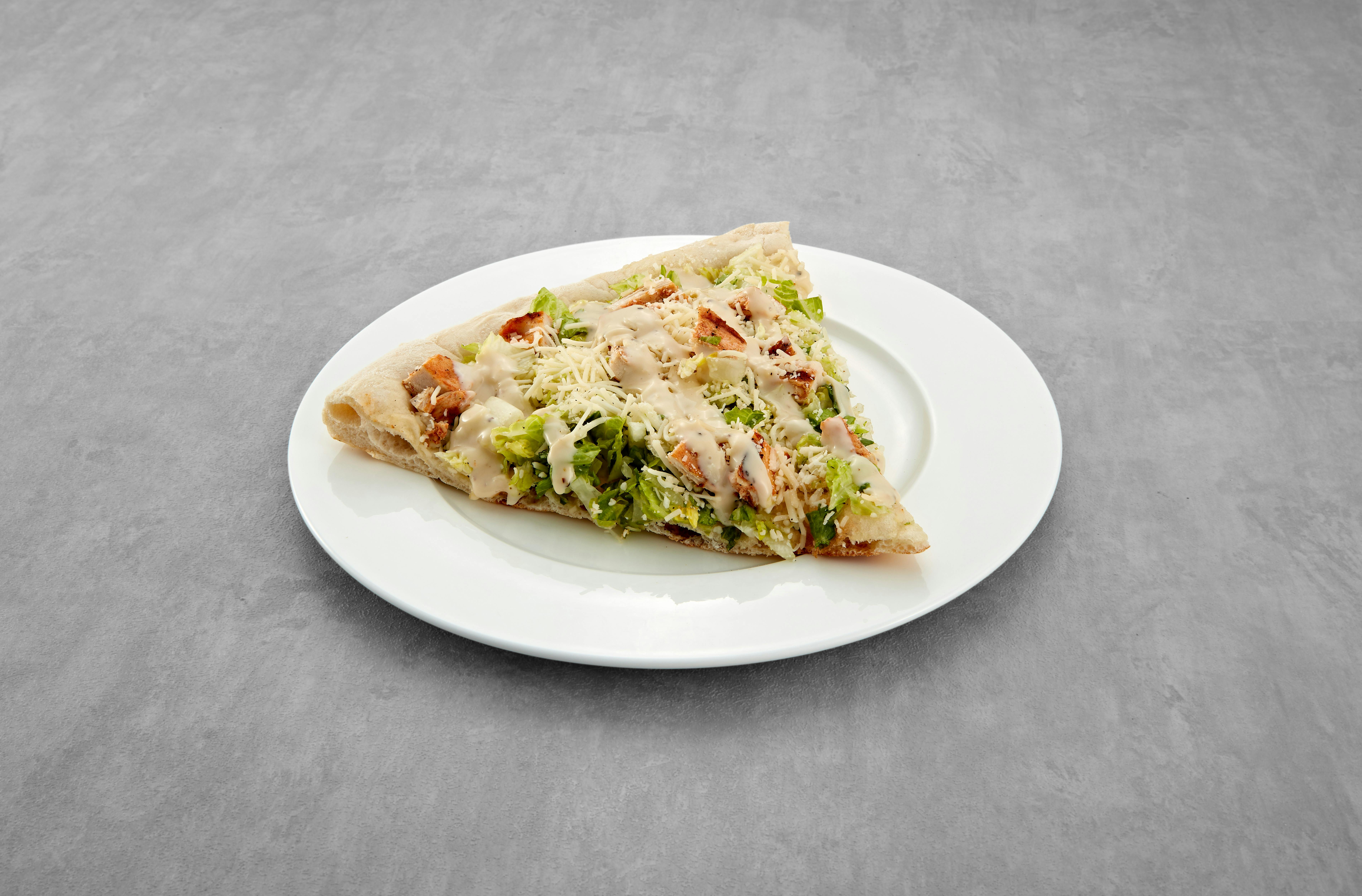 Chicken Caesar Salad Pizza Slice from Mario's Pizzeria in Seaford, NY