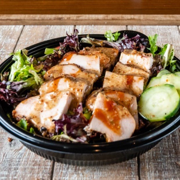 Mixed Green Salad Topped With Sliced Smoked Chicken Breast from Beef Butter BBQ - N Sherman Ave in Madison, WI