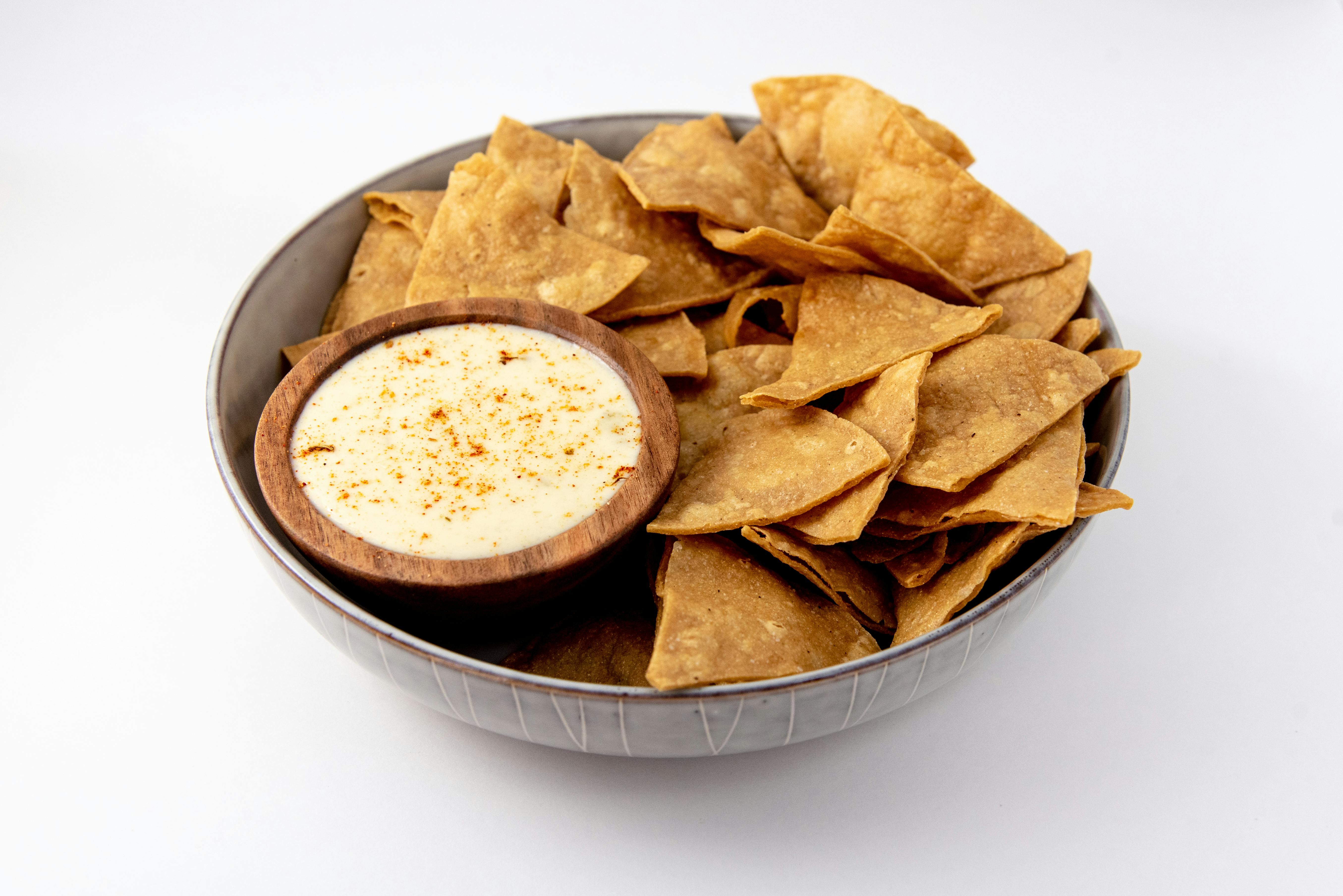 Yellow Corn Tortilla Chips & White Cheddar-Green Chili Queso from Taco Royale - Mormon Coulee Rd in La Crosse, WI