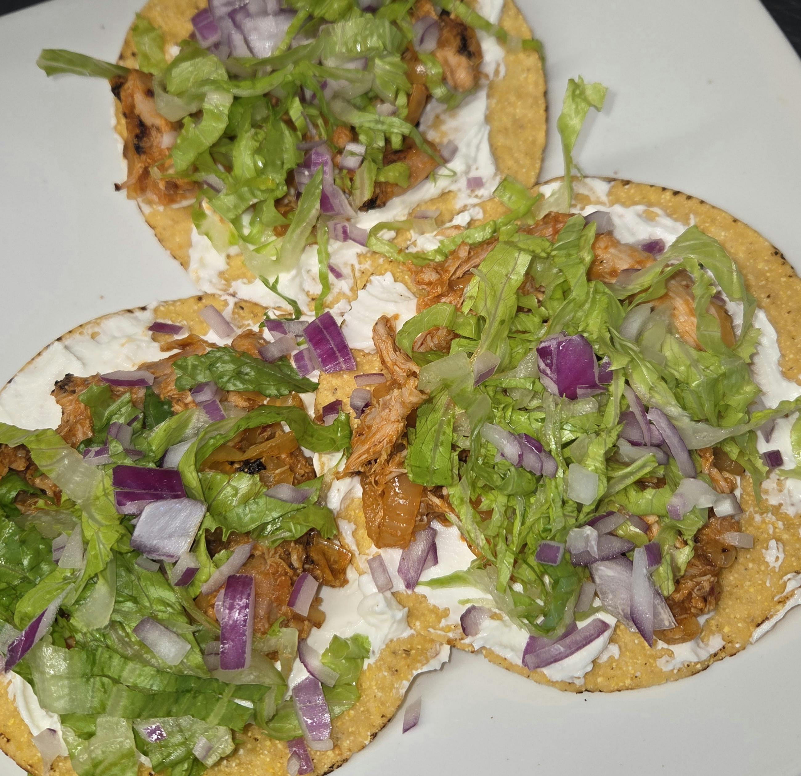 Chicken Tinga Tostada from Inga's Alpine Tavern in Denver, CO